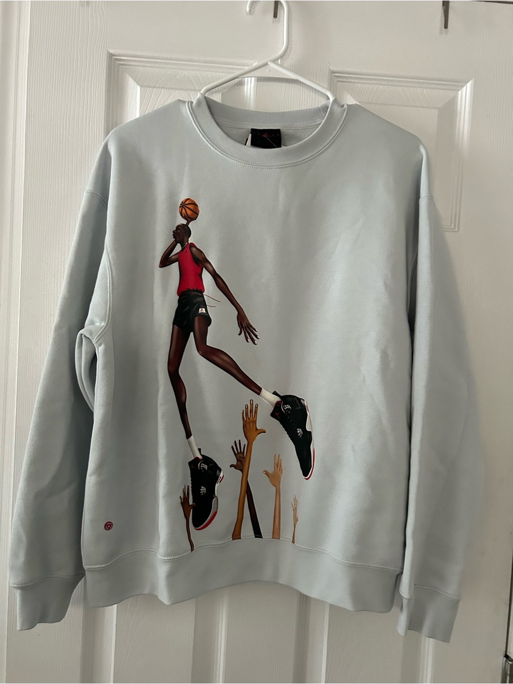 Jordan Light Blue Crewneck Sweatshirt with Basketball Jump Graphic